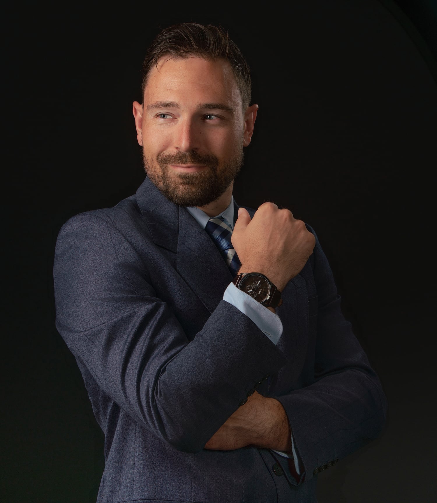 Executive branding portrait on a dark background