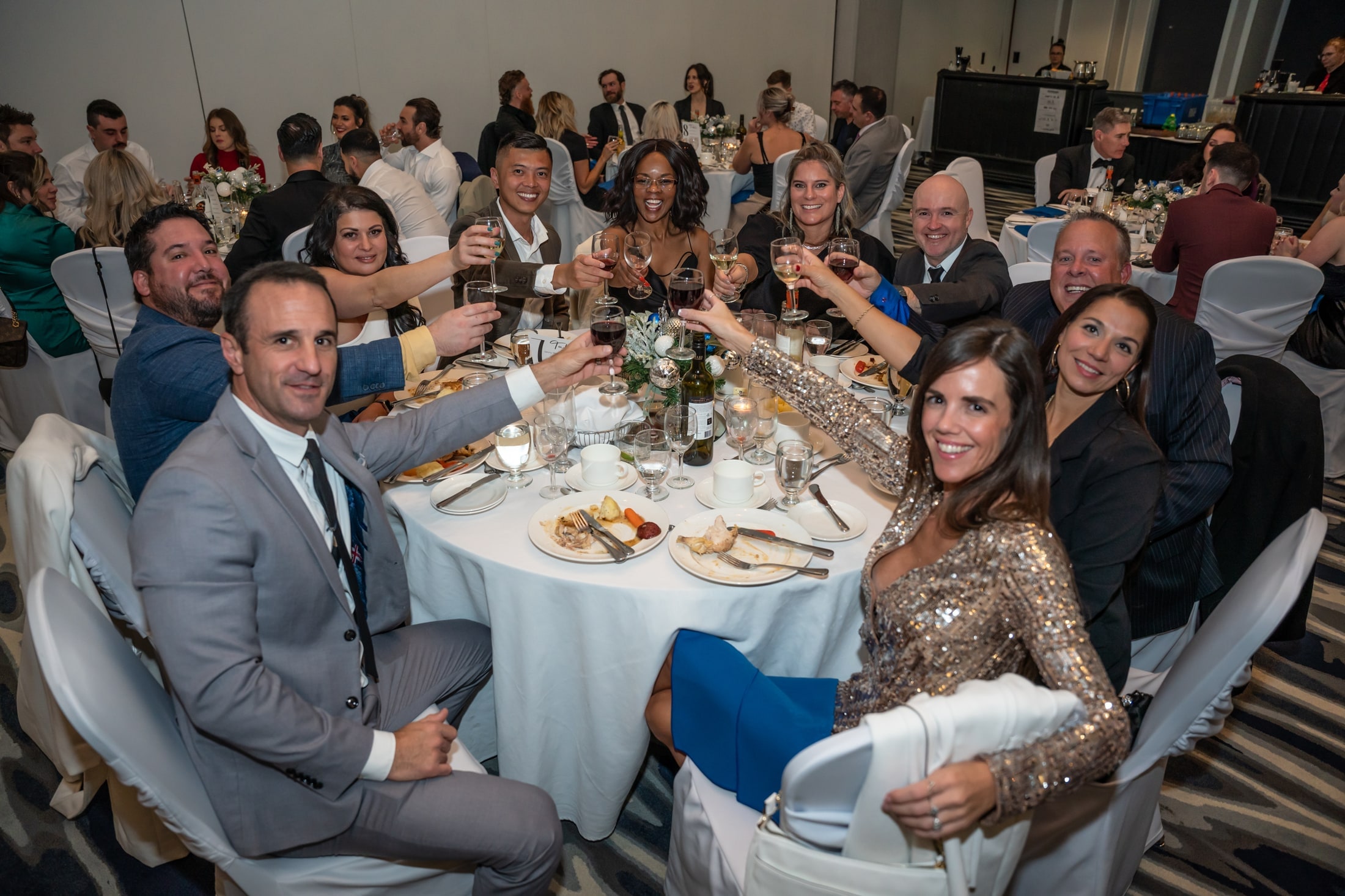 Guests raising a toast at an event dinner